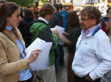 Woman and man having a conversation on the street.